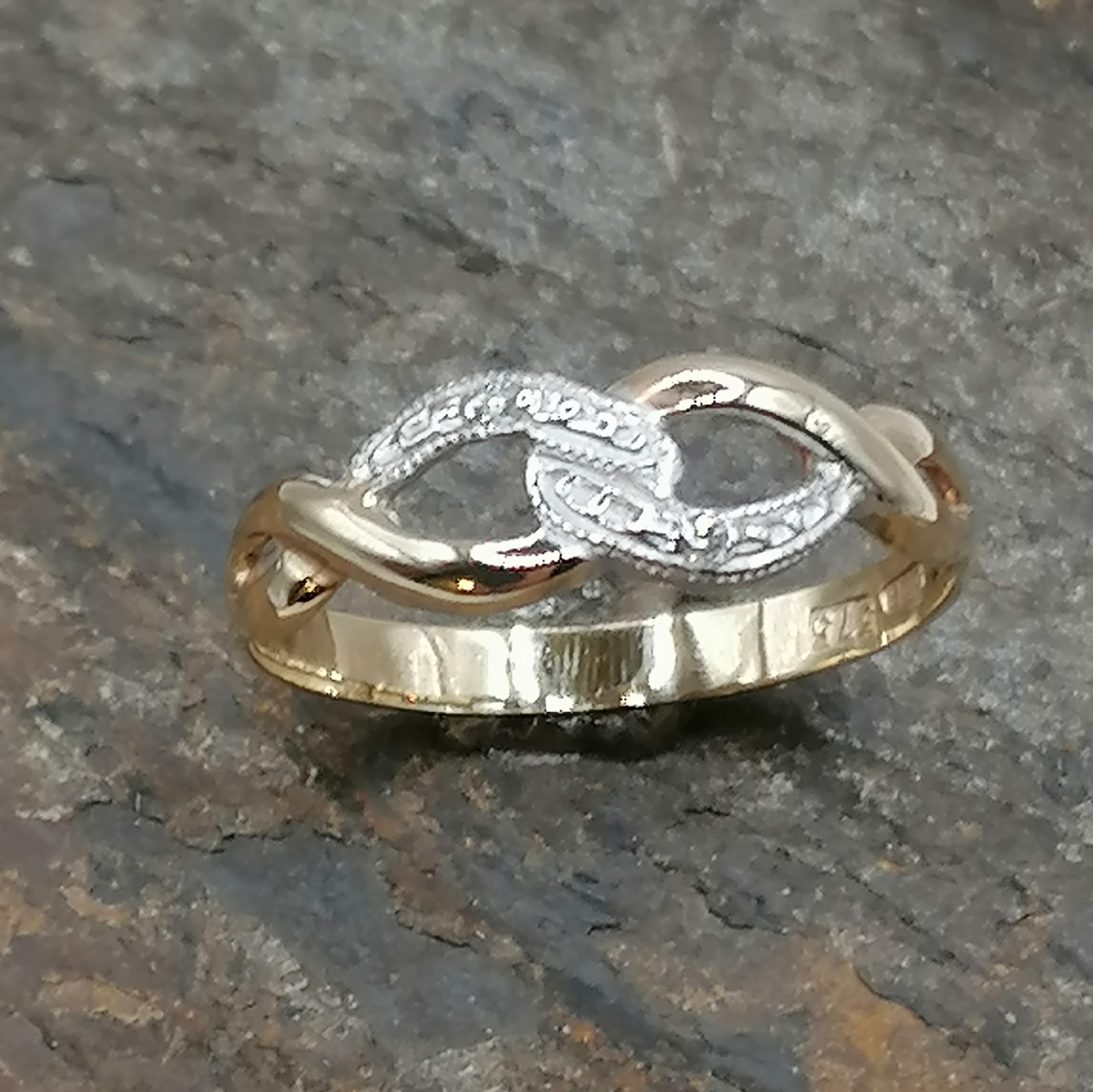 Nine carat knot dress ring with diamonds