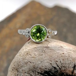 Vintage style Peridot and diamond dress ring in white gold