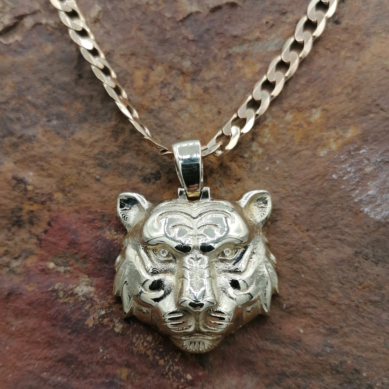 Gold tiger head pendant